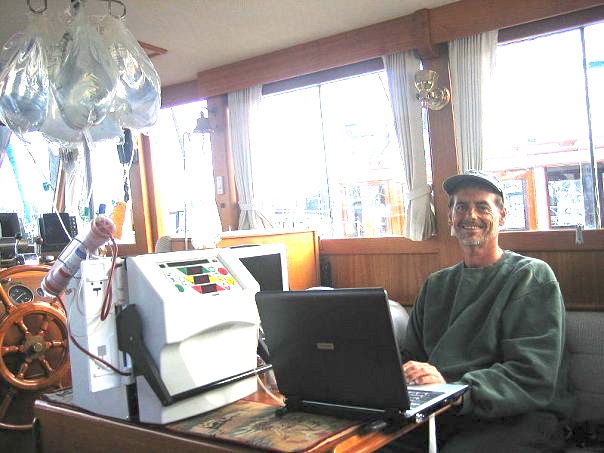 My favorite photo of Bill—captaining a boat for a weekend trip with friends.