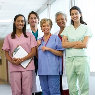 A group of medical professionals standing in a hallway AI-generated content may be incorrect.
