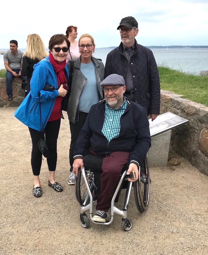 A group of people posing for a photo Description automatically generated with medium confidence