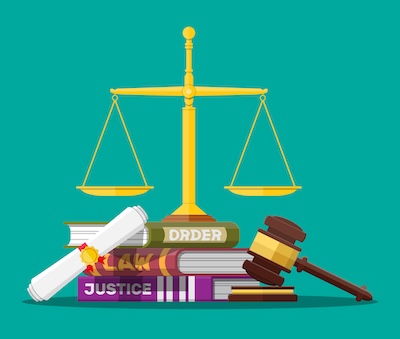Law code books, justice scales and judge gavel.