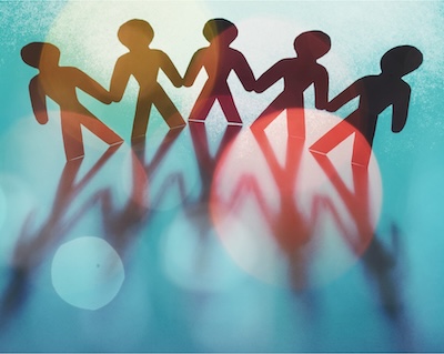 People holding hands and offering assistance to a person in need.